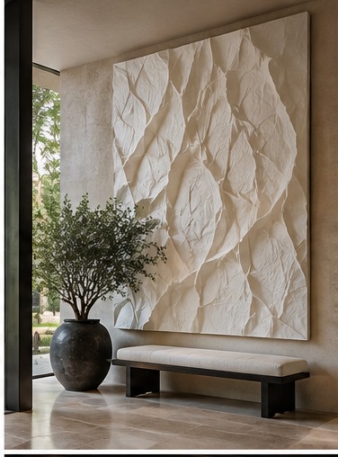Large-scale white textural relief artwork in an entry hall